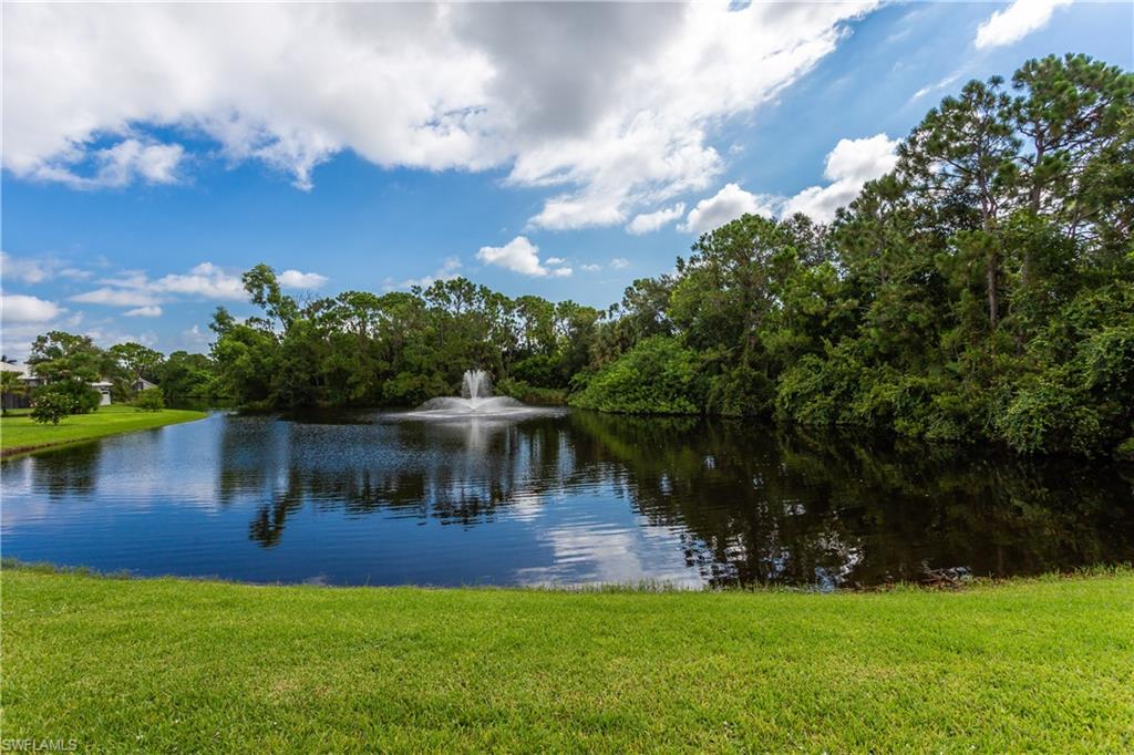 6578 Ridgewood Drive Naples, FL 34108 - Photo 34 of 35 a view of a house with a yard