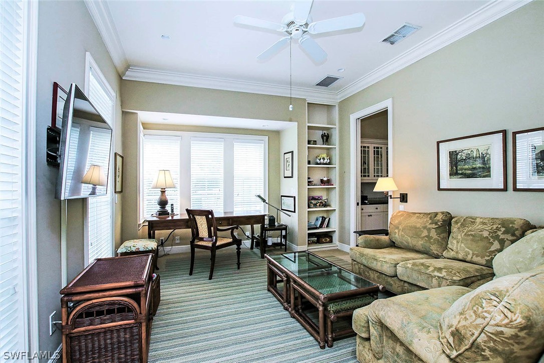 1358 Sand Castle Road Sanibel, FL 33957 - Photo 13 of 26 a living room with furniture a wooden floor and a window