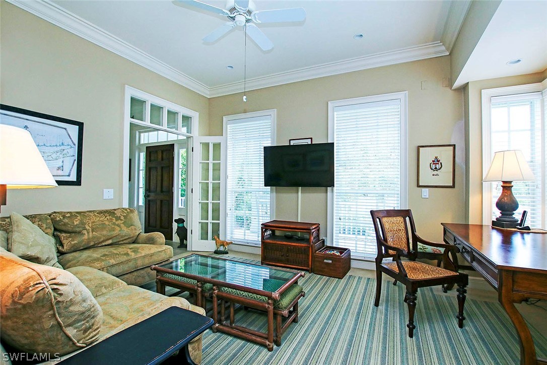1358 Sand Castle Road Sanibel, FL 33957 - Photo 14 of 26 a living room with furniture and a flat screen tv
