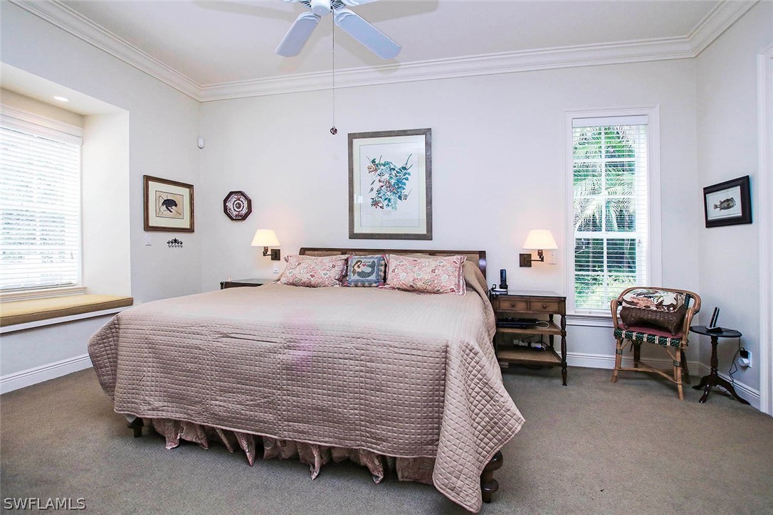 1358 Sand Castle Road Sanibel, FL 33957 - Photo 15 of 26 a bedroom with a bed and a window