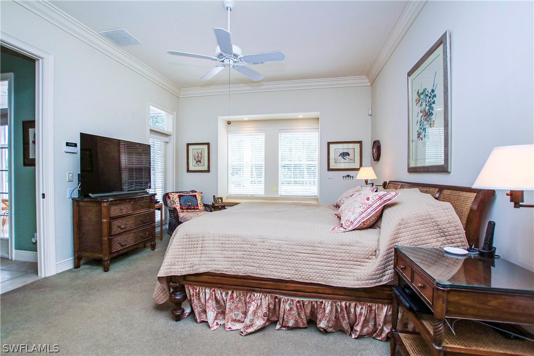 1358 Sand Castle Road Sanibel, FL 33957 - Photo 16 of 26 a bedroom with a bed and flat screen tv