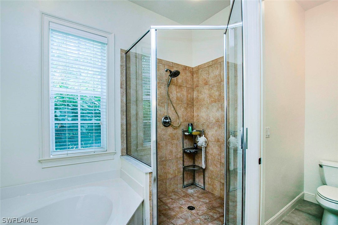 1358 Sand Castle Road Sanibel, FL 33957 - Photo 18 of 26 a bathroom with a shower and a toilet