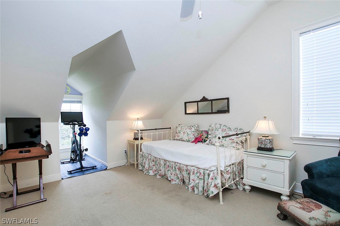 1358 Sand Castle Road Sanibel, FL 33957 - Photo 19 of 26 a bedroom with furniture and a chandelier