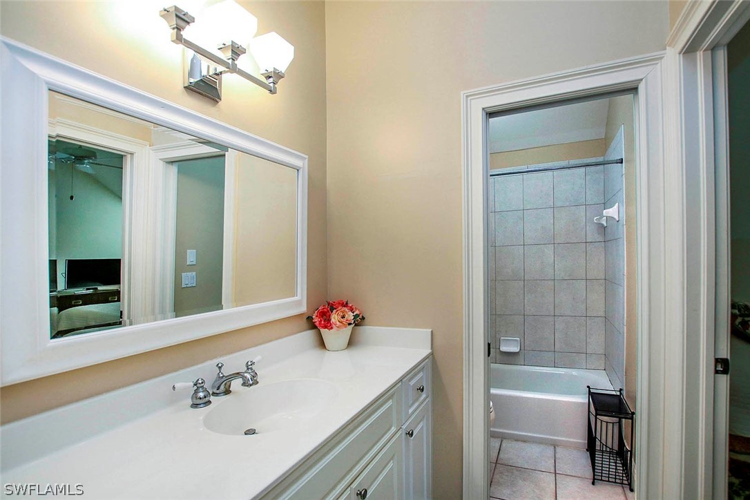 1358 Sand Castle Road Sanibel, FL 33957 - Photo 21 of 26 a bathroom with a bathtub sink and mirror