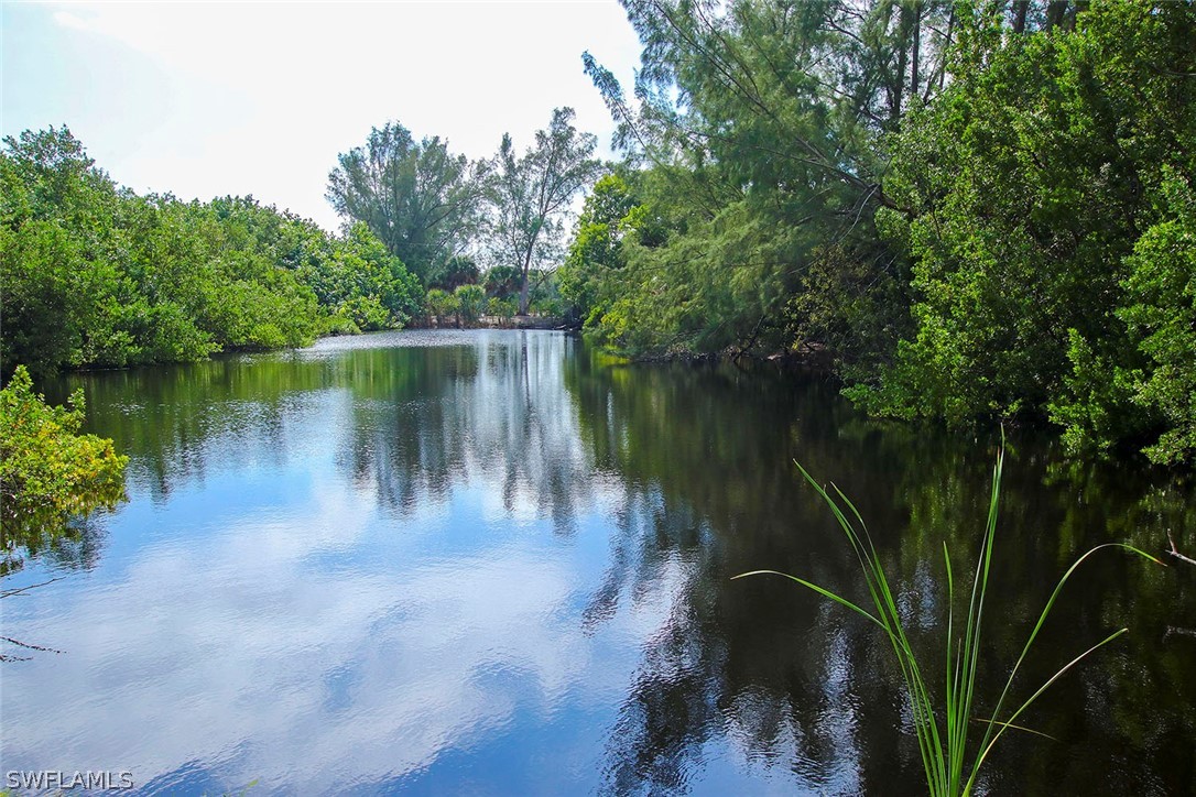 1358 Sand Castle Road Sanibel, FL 33957 - Photo 4 of 26 a view of a lake view with a garden