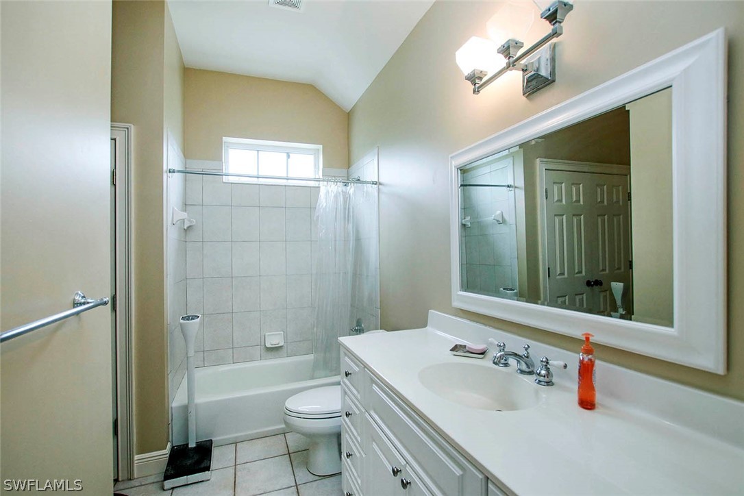 1358 Sand Castle Road Sanibel, FL 33957 - Photo 5 of 26 a bathroom with a sink a toilet a mirror and shower