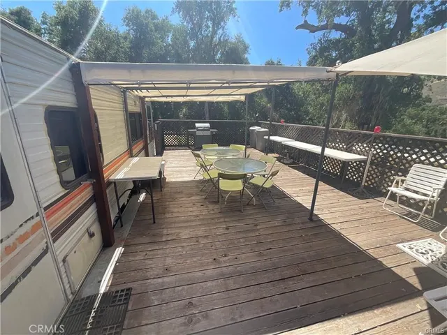 a view of sitting area with furniture and wooden deck