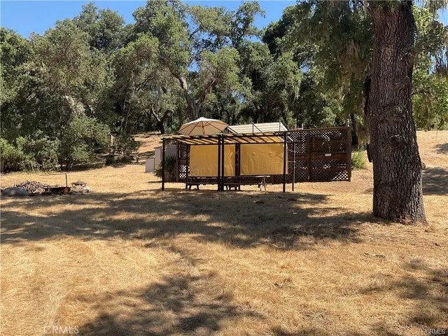 a view of a street with of a house in the background