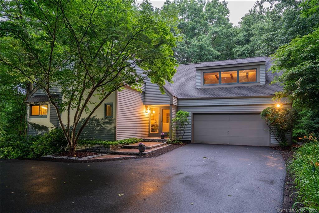 65 Buttonwood Hill Road Avon, CT 06001 - Photo 1 of 1 a house view with a garden space