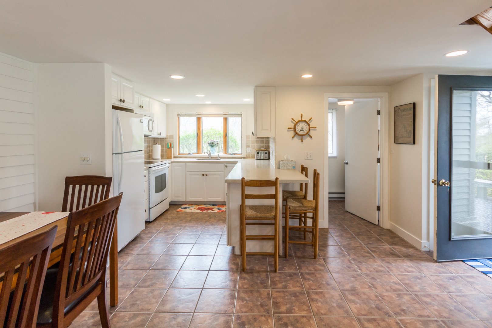 12 Mattakesett Bay Road, Unit M08 Edgartown, MA 02539 - Photo 5 of 40 Dining with easy kitchen access.