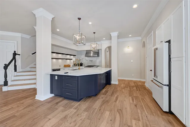 a bathroom with a sink a mirror and a shower