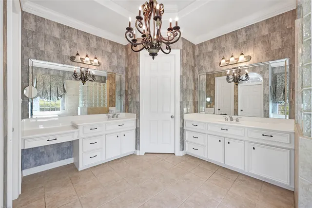 a spacious bathroom with a granite countertop sink mirror and a bathtub