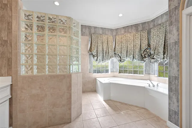 a bathroom with a bathtub and shower