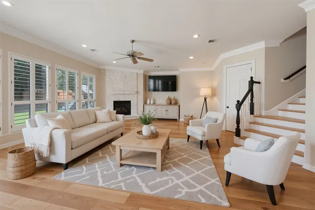 a living room with furniture and a fireplace