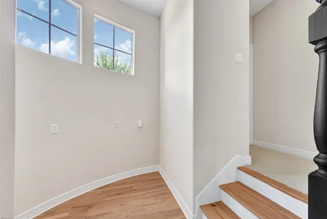 a view of front door with wooden floor