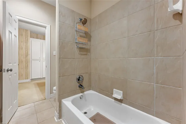 a bathroom with a tub and a sink