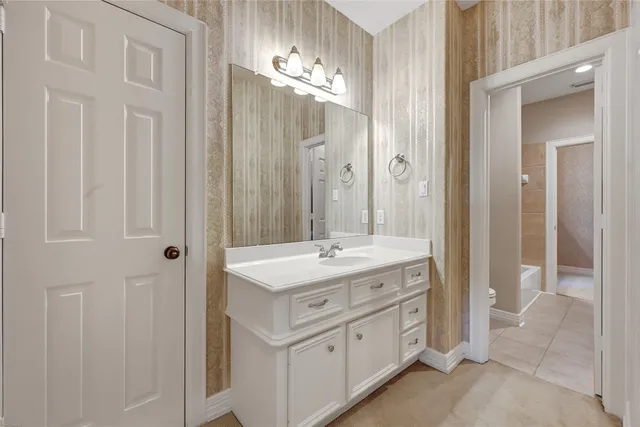 a bathroom with a double vanity sink and mirror