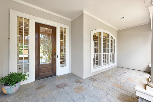 a view of an empty room with windows