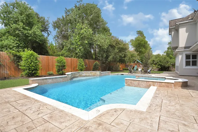 a view of swimming pool with chairs