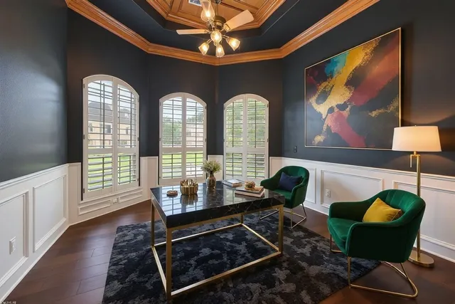 a living room with furniture and a floor to ceiling window