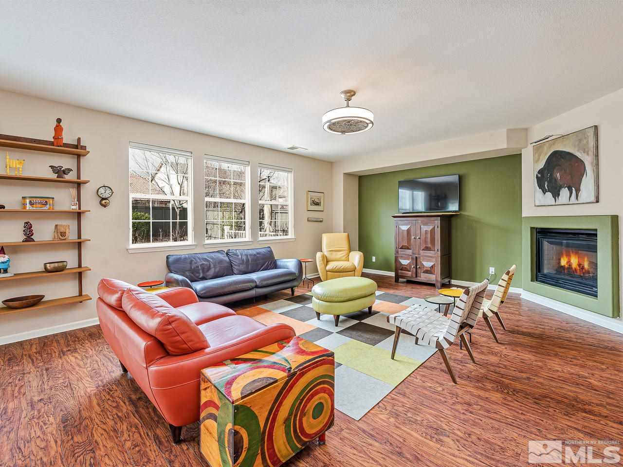 570 Little Sorrel Court Reno, NV 89521 - Photo 5 of 16 a living room with furniture and a fireplace
