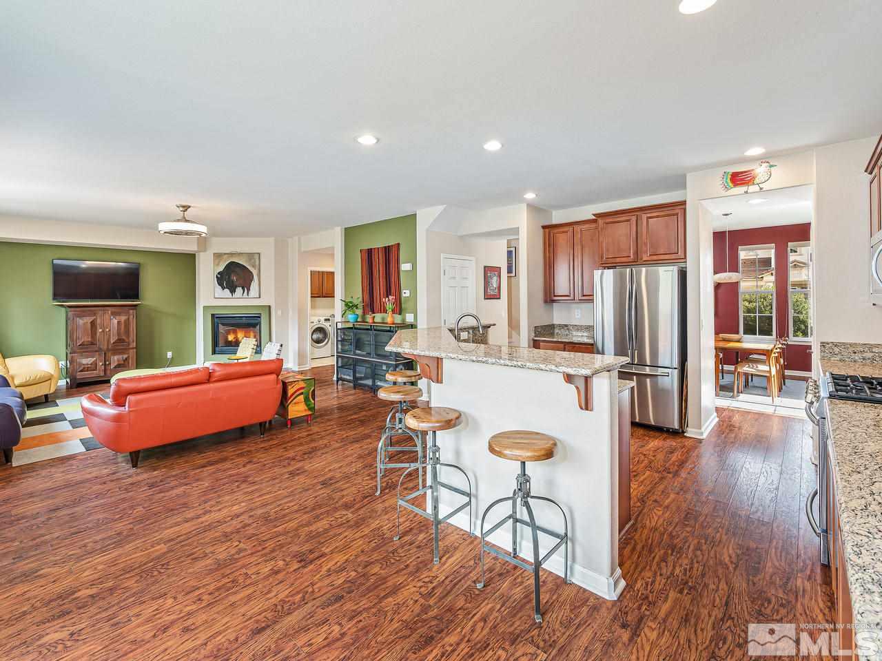570 Little Sorrel Court Reno, NV 89521 - Photo 6 of 16 a living room with furniture a wooden floor and next to a window