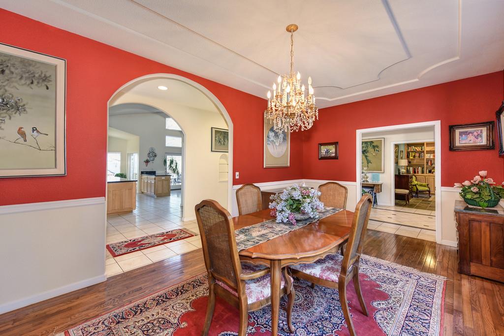 24200 Golden Ridge Drive Volcano, CA 95689 - Photo 21 of 58 a view of a dining room with furniture and chandelier