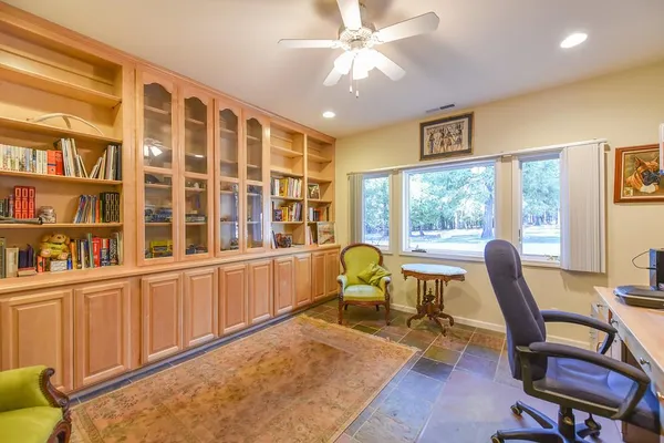 a kitchen with granite countertop a sink and a large window