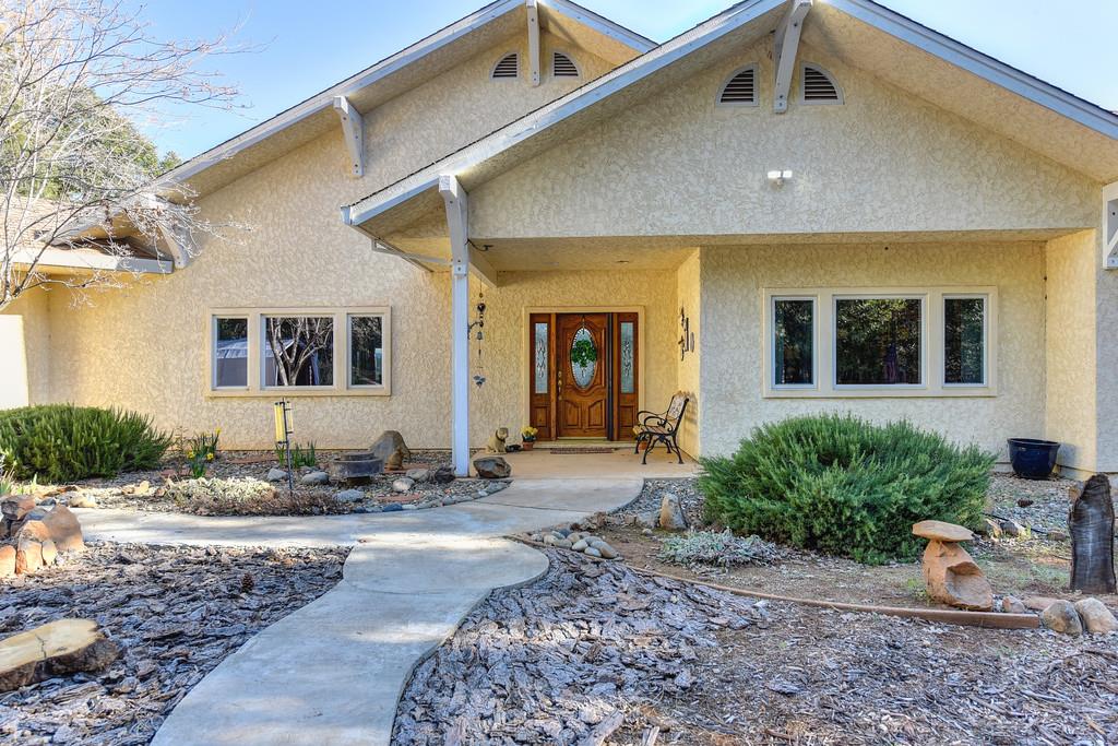 24200 Golden Ridge Drive Volcano, CA 95689 - Photo 3 of 58 a front view of a house with sitting area