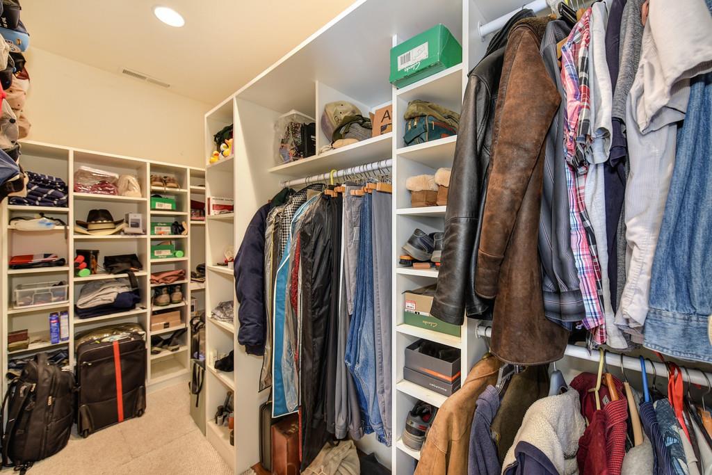 24200 Golden Ridge Drive Volcano, CA 95689 - Photo 32 of 59 a view of walk in closet with clothes and shoes