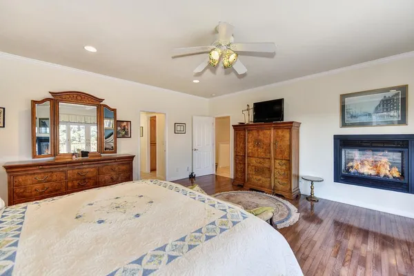 a living room with furniture window and wooden floor