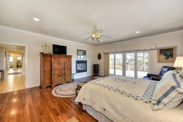 a bedroom with a large bed and a large window