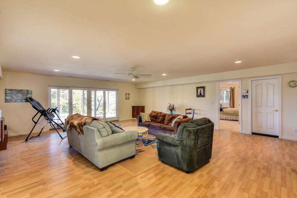 24200 Golden Ridge Drive Volcano, CA 95689 - Photo 41 of 58 a living room with furniture and a wooden floor
