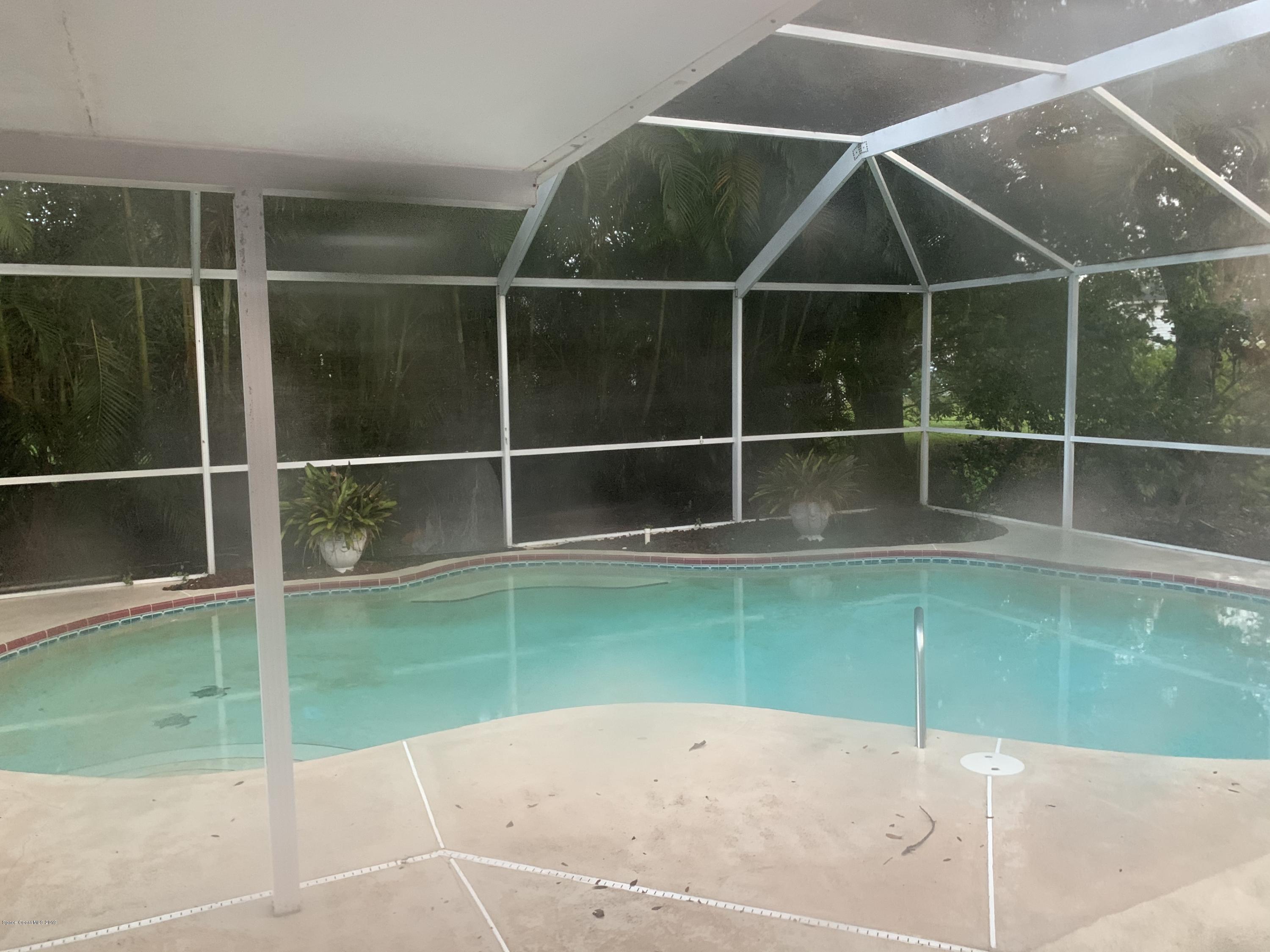 2023 Lansing Street Melbourne, FL 32935 - Photo 13 of 13 screened pool and patio