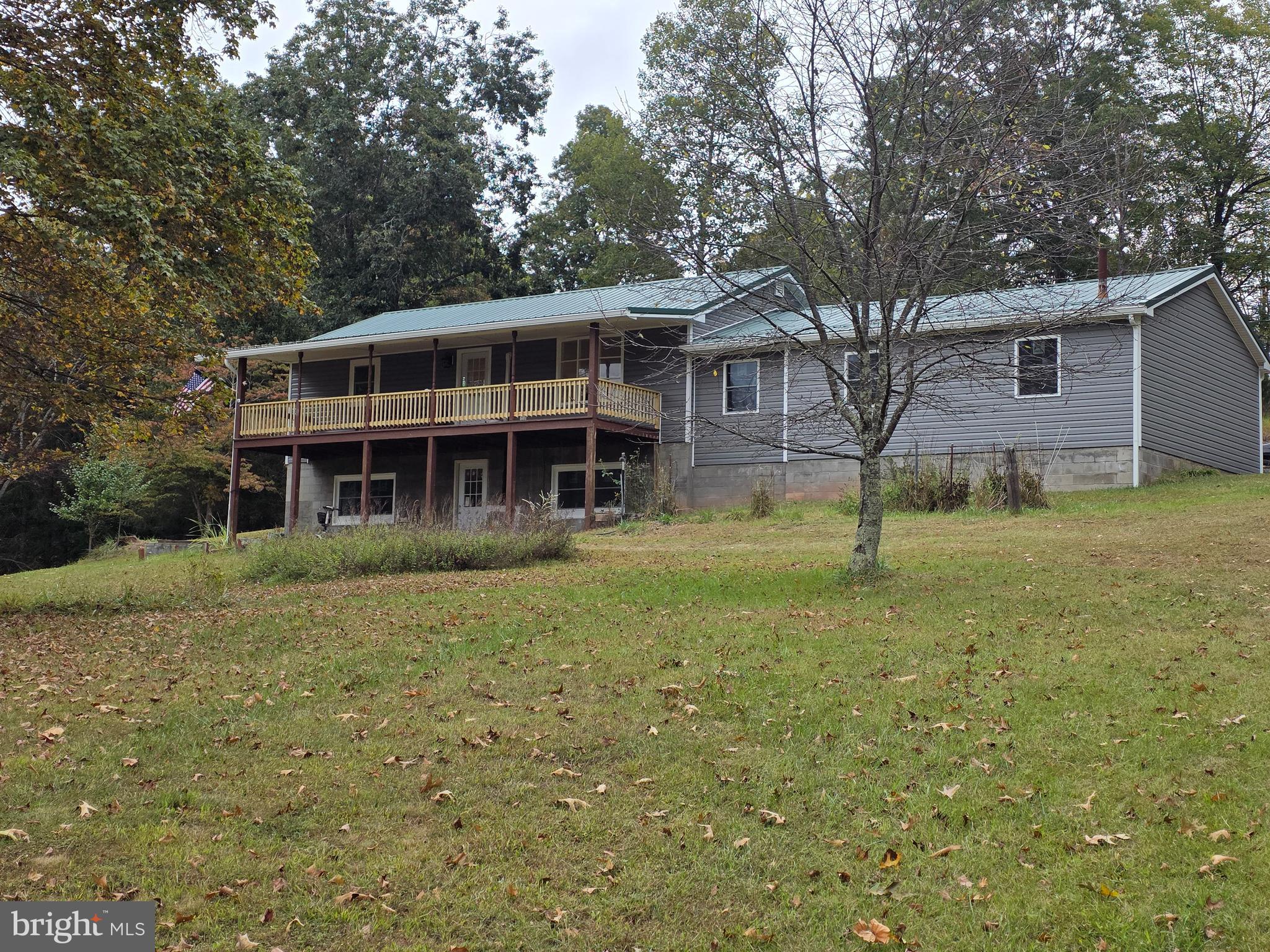 3939 Virginia Line Road Berkeley Springs, WV 25411 - Photo 2 of 51 a view of a house with a yard