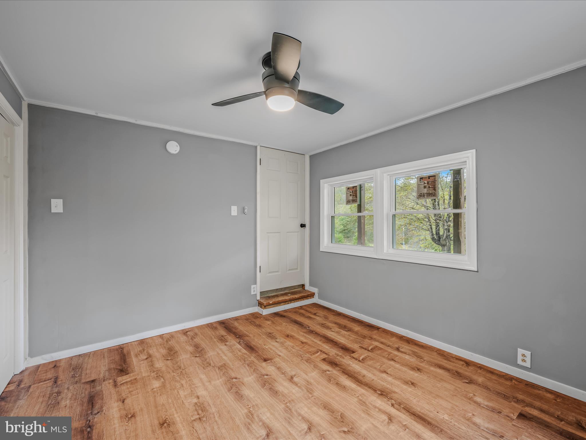 3939 Virginia Line Road Berkeley Springs, WV 25411 - Photo 25 of 51 a view of an empty room with a window