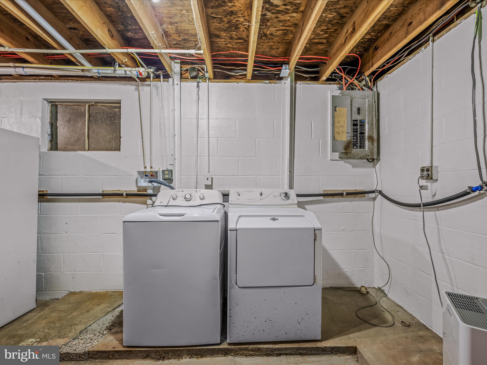3939 Virginia Line Road Berkeley Springs, WV 25411 - Photo 27 of 51 a room with water heater and a wooden cabinets