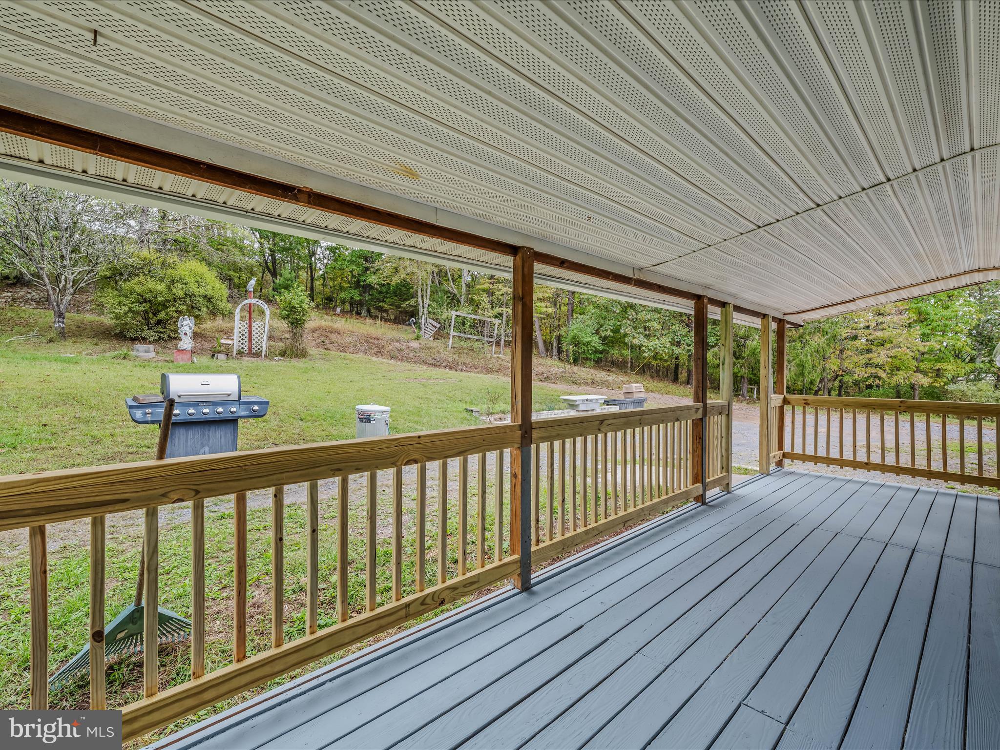 3939 Virginia Line Road Berkeley Springs, WV 25411 - Photo 32 of 51 a view of a balcony with wooden floor