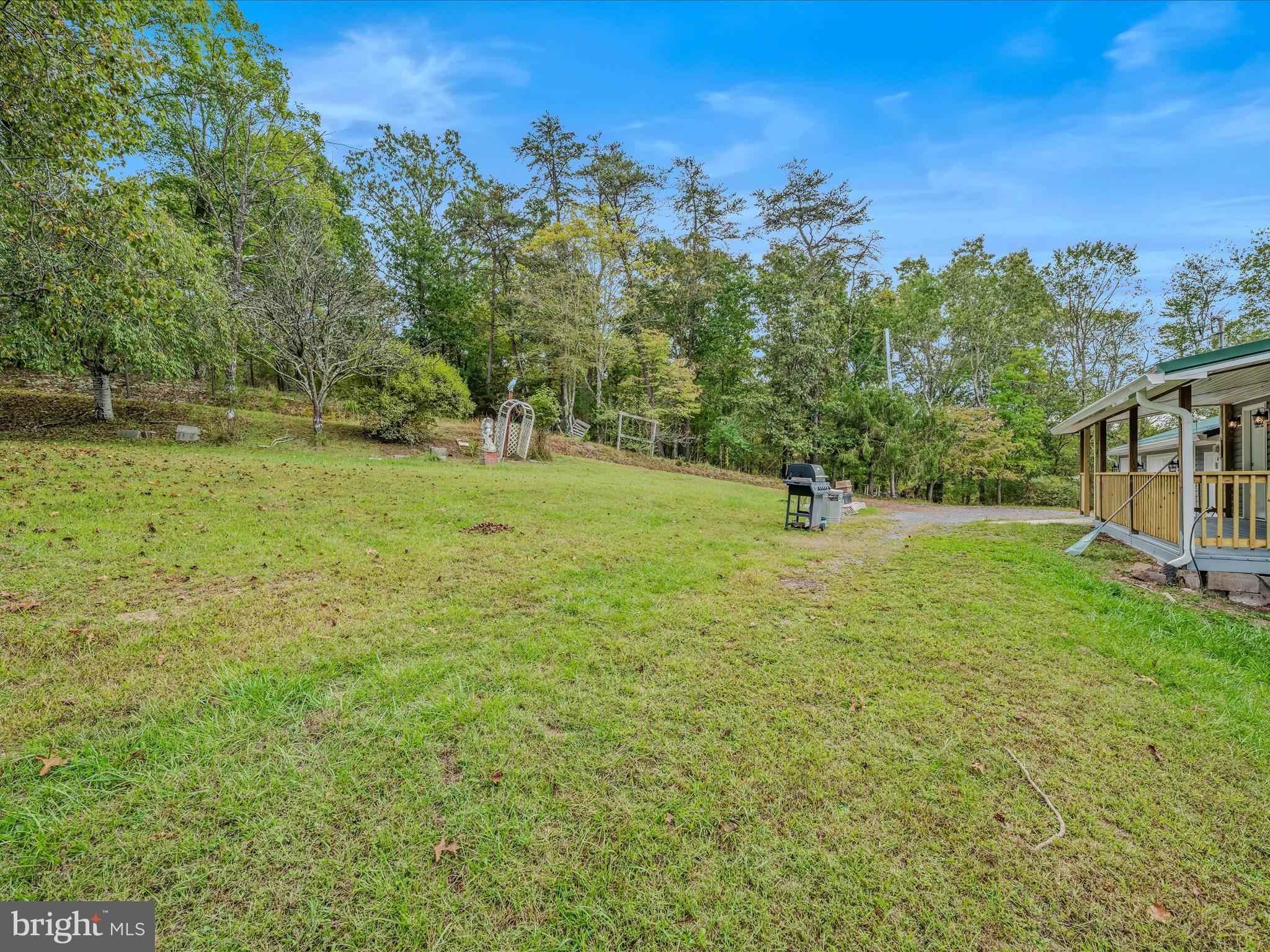 3939 Virginia Line Road Berkeley Springs, WV 25411 - Photo 33 of 51 a view of outdoor space with deck and yard