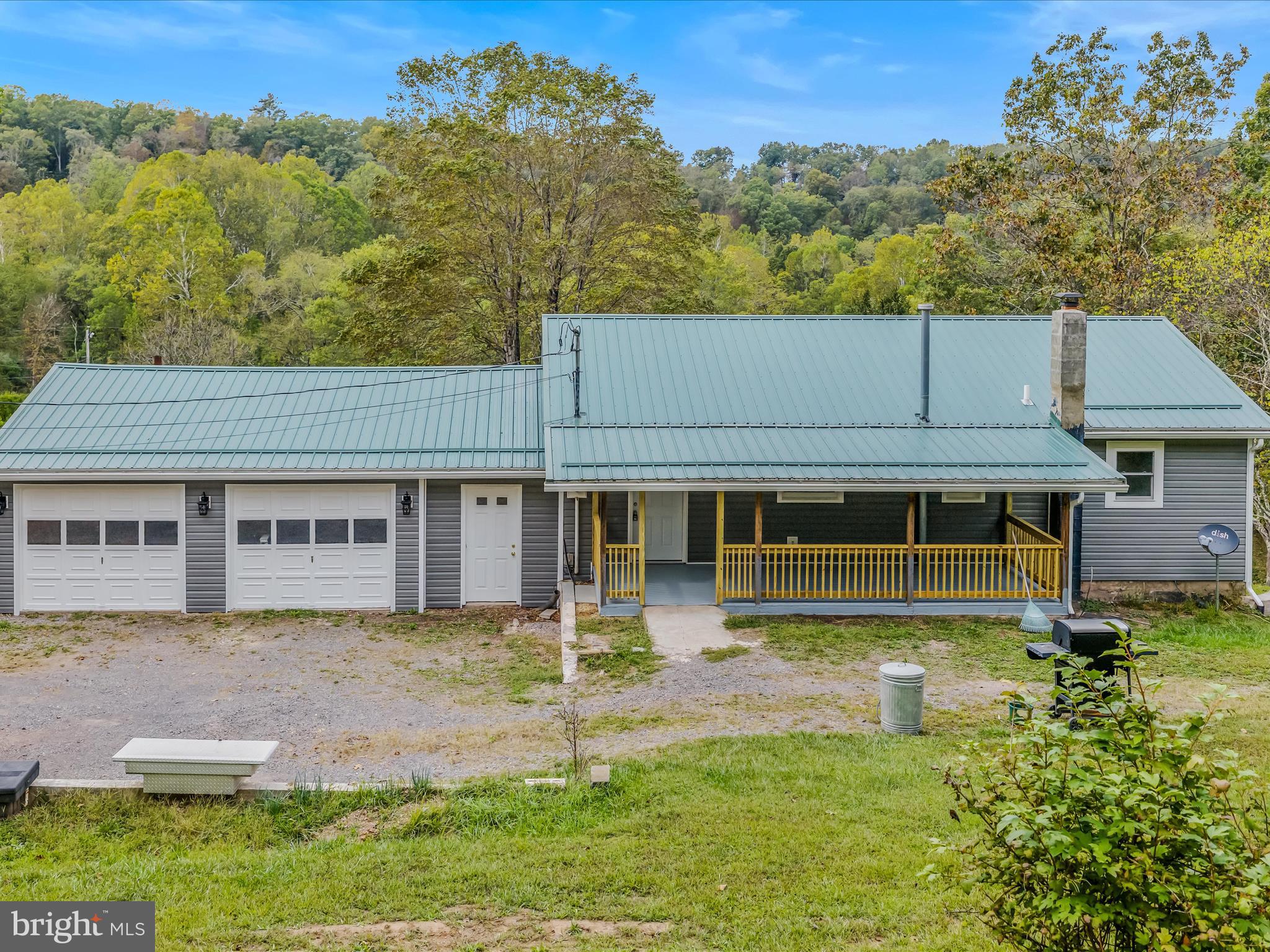 3939 Virginia Line Road Berkeley Springs, WV 25411 - Photo 35 of 51 front view of a house with a yard