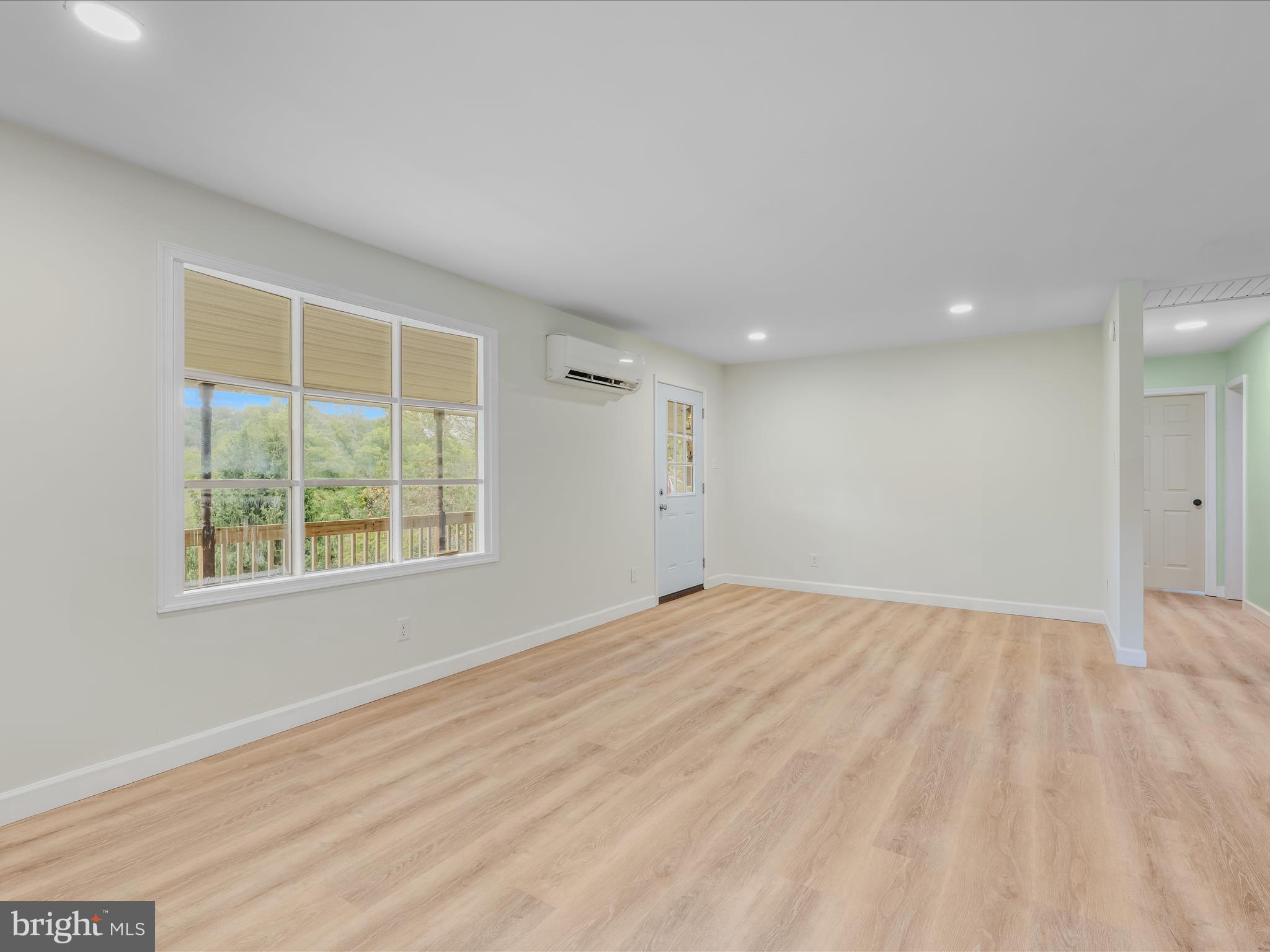 3939 Virginia Line Road Berkeley Springs, WV 25411 - Photo 4 of 51 a view of an empty room with a window