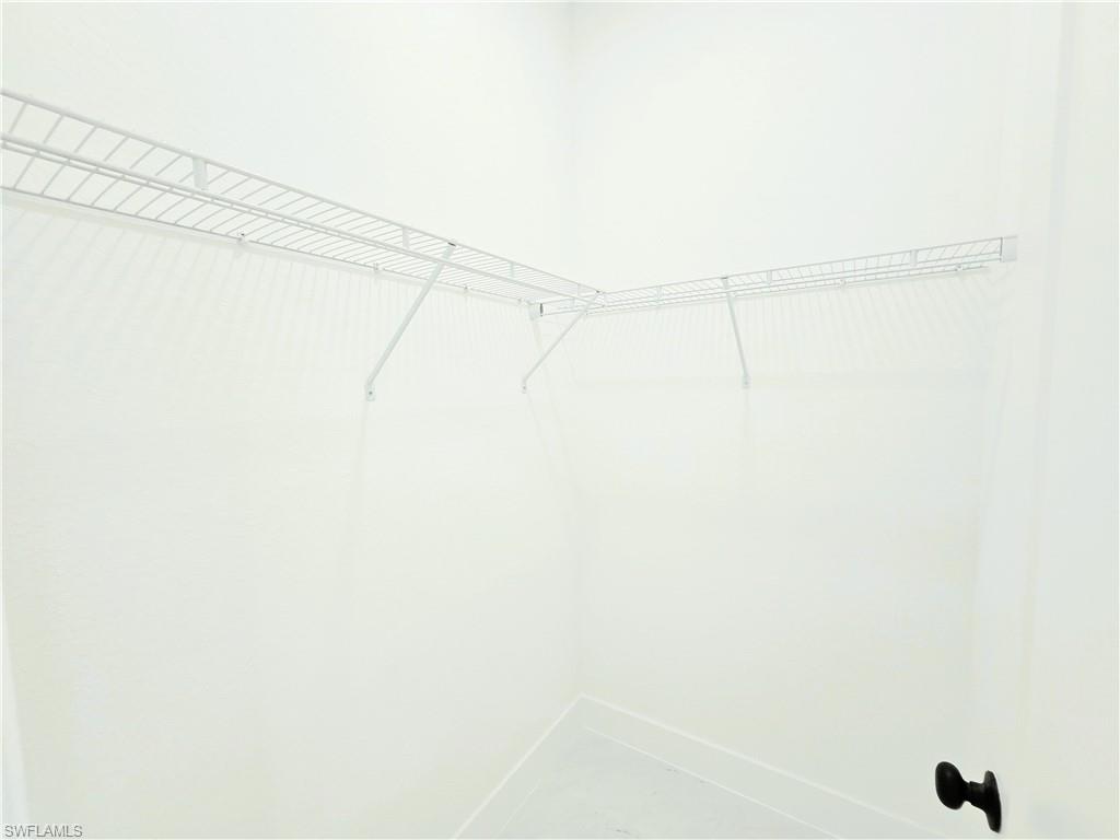 2522 Alice Place Lehigh Acres, FL 33971 - Photo 19 of 34 a view of a rack on the wall