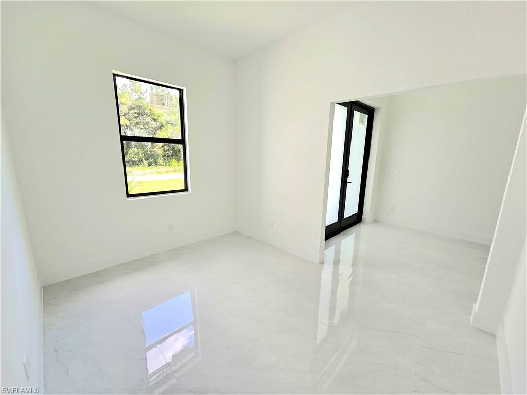 2522 Alice Place Lehigh Acres, FL 33971 - Photo 26 of 34 an empty room with windows and closet