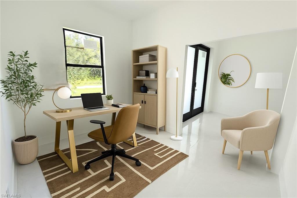 2522 Alice Place Lehigh Acres, FL 33971 - Photo 27 of 34 a work room with furniture a rug and a window
