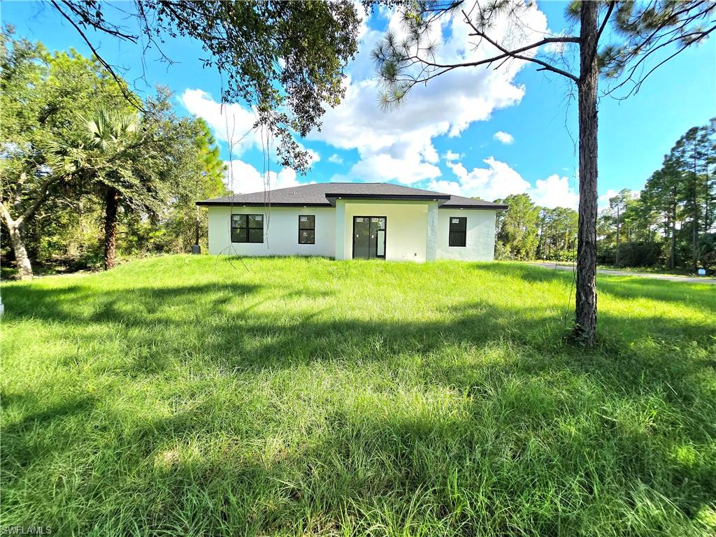 2522 Alice Place Lehigh Acres, FL 33971 - Photo 30 of 34 a view of backyard of a house