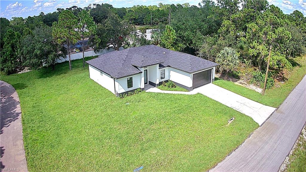 2522 Alice Place Lehigh Acres, FL 33971 - Photo 4 of 34 a view of a yard in front of house