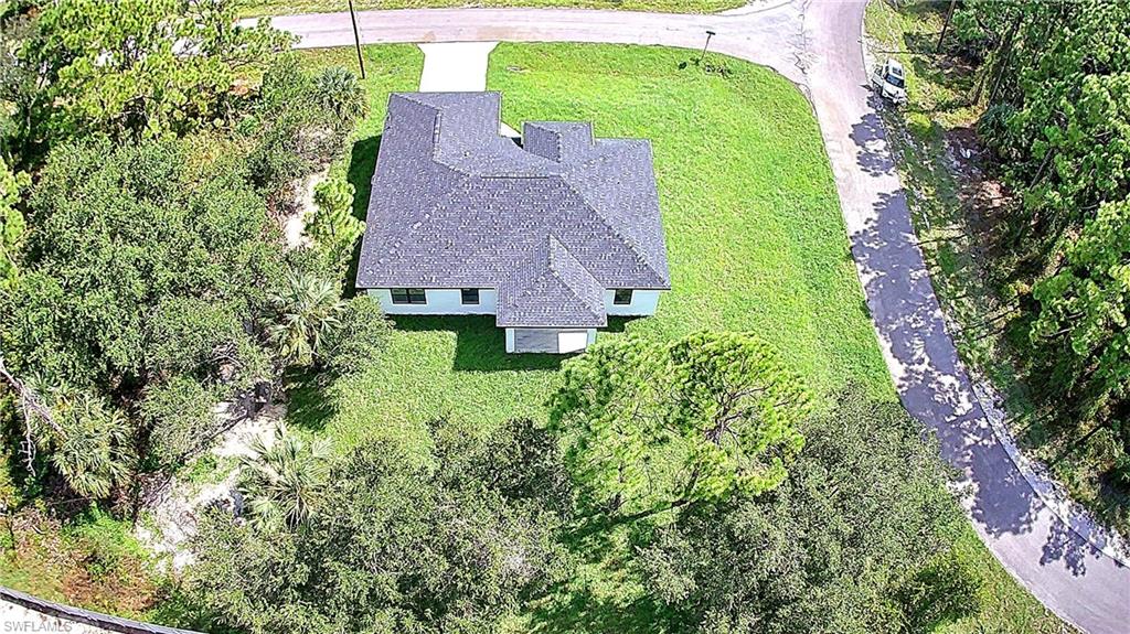 2522 Alice Place Lehigh Acres, FL 33971 - Photo 5 of 34 an aerial view of a house