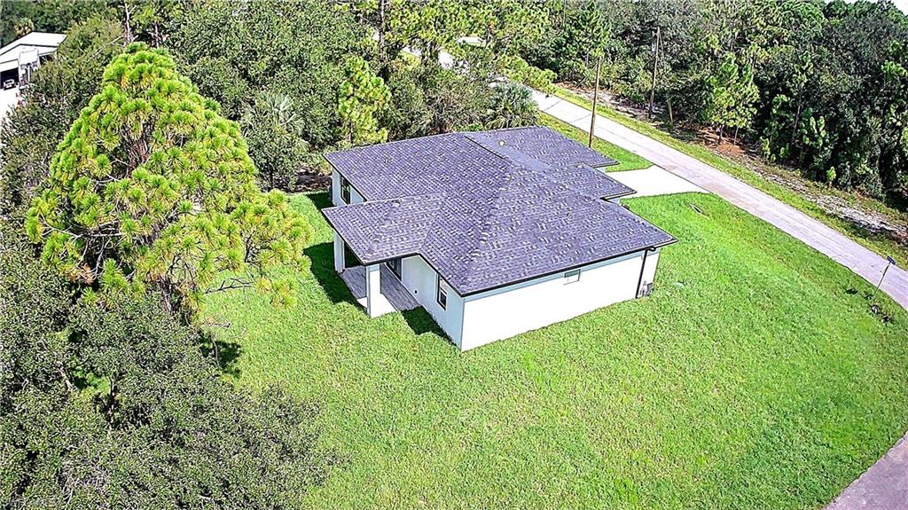 2522 Alice Place Lehigh Acres, FL 33971 - Photo 6 of 34 a view of a garden with plants
