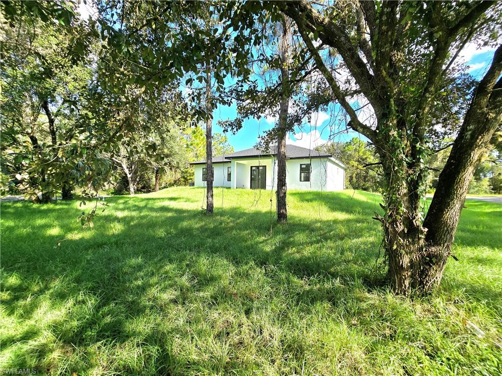 2522 Alice Place Lehigh Acres, FL 33971 - Photo 7 of 34 a view of house with backyard