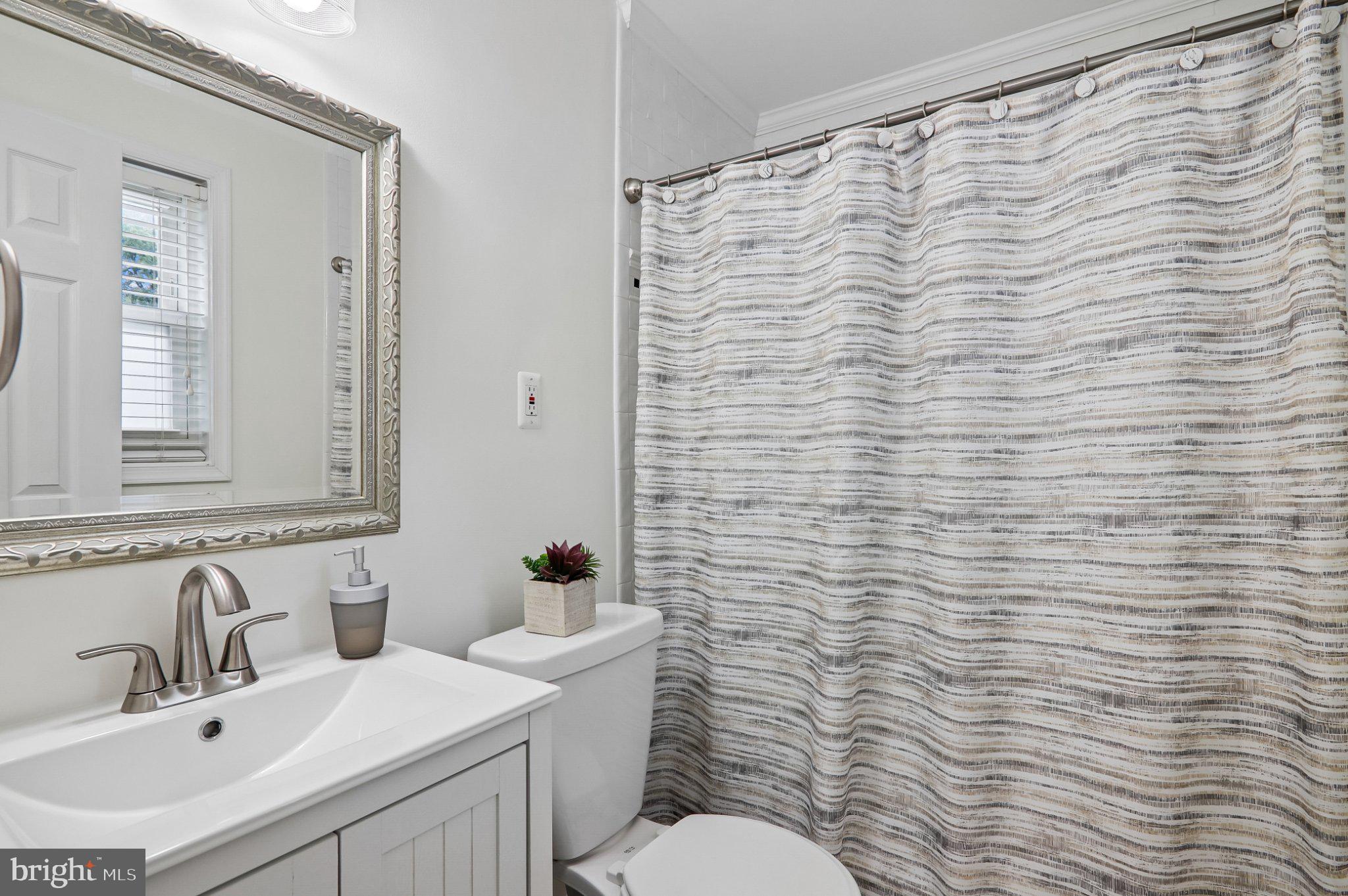 3103 Walnut Street Northeast Washington, DC 20018 - Photo 31 of 40 Modern bathroom with elegant touches.